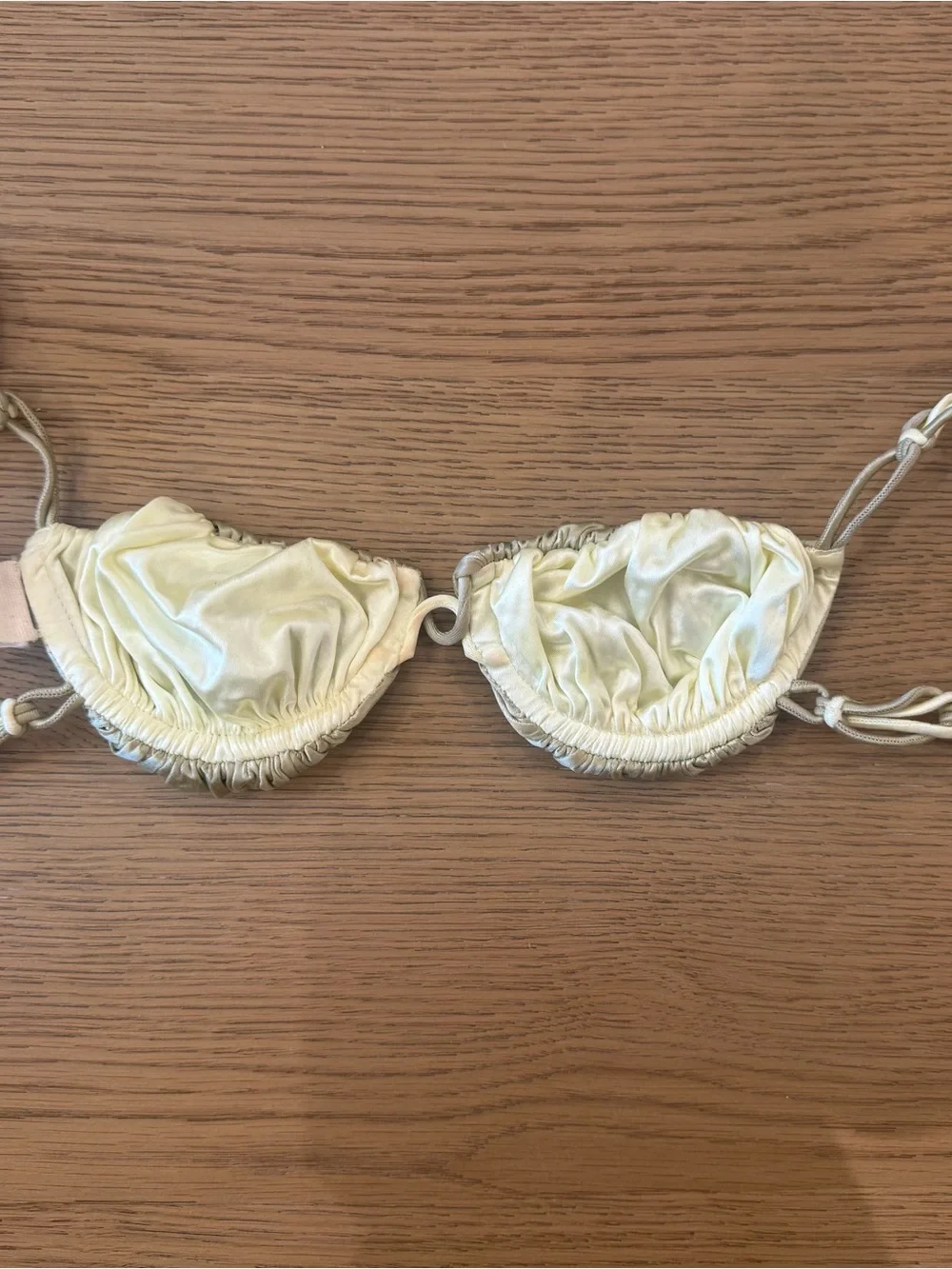 Isa Boulder Satin Ruched Bikini Top in Pale Gold